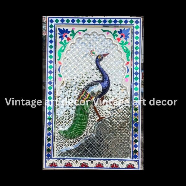 An Elegant Peacock Posing for you to glace at its Visible Feathers and Aesthetics.